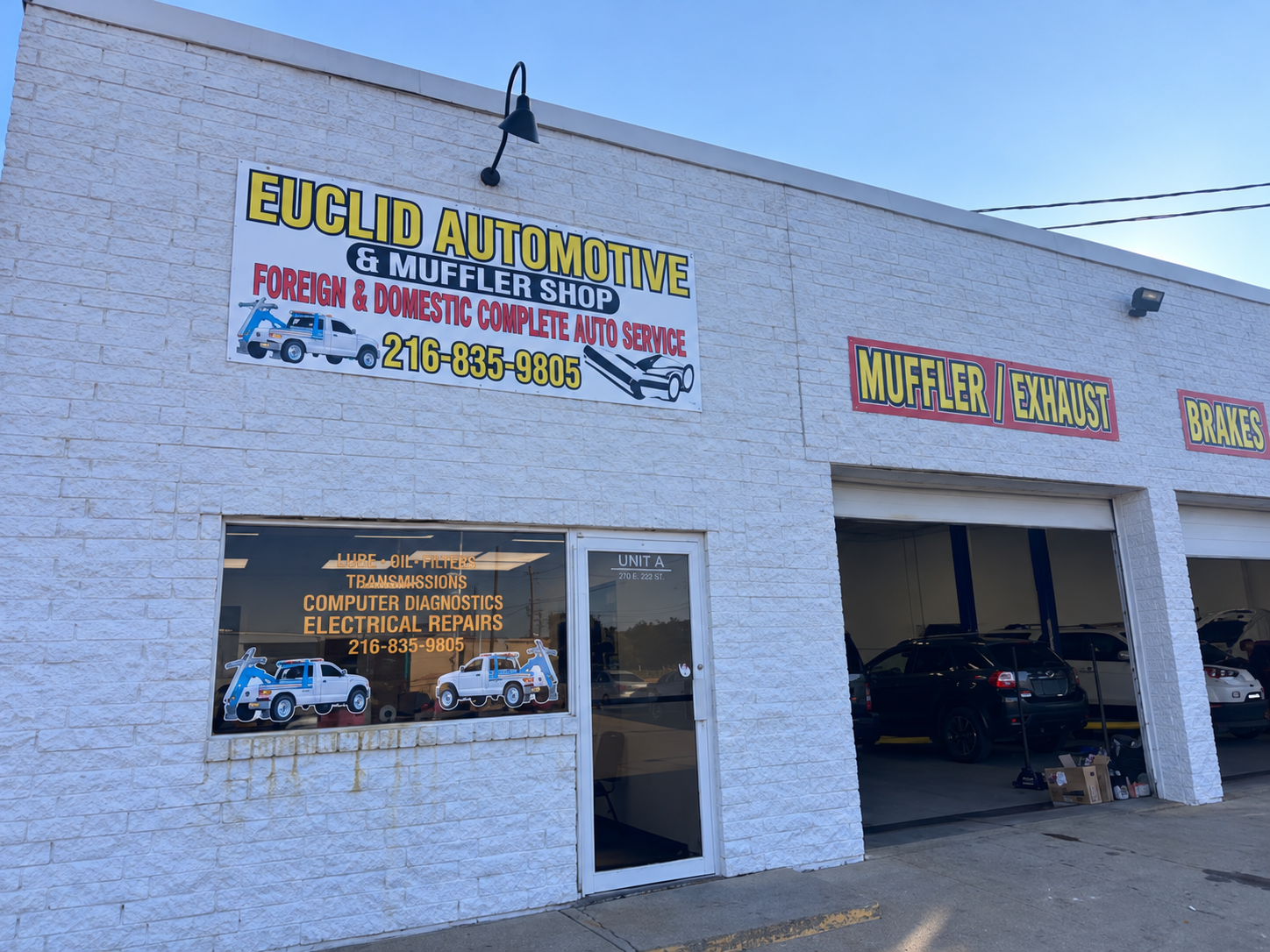 Euclid Automotive storefront with shop sign, office entrance and open service bay